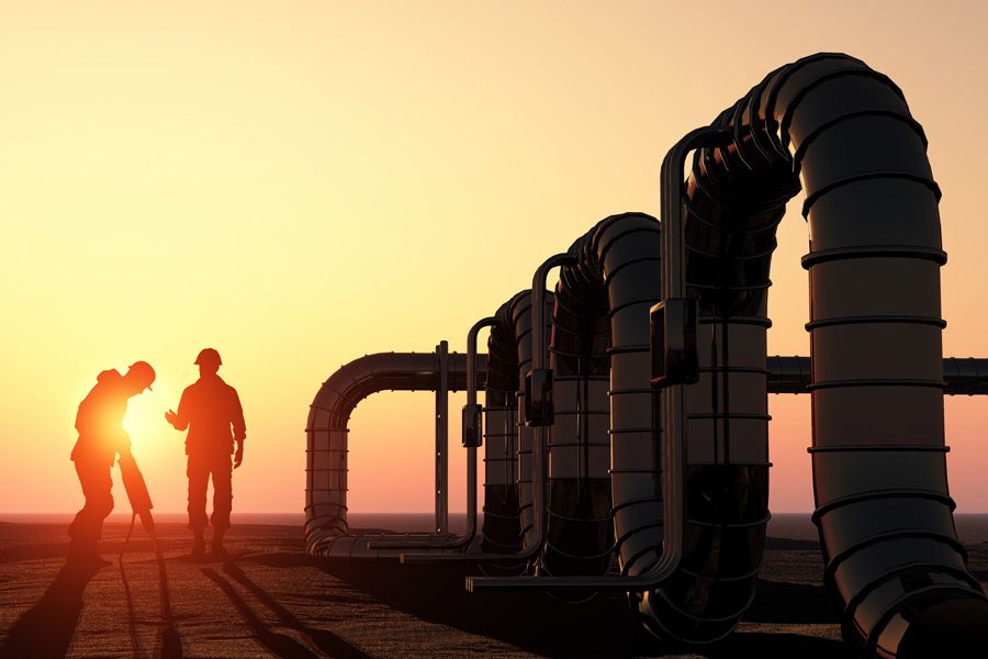 Eni Spa Oil and Gas – Oil workers checking oil pump Eni Spa Oil and Gas – Oil workers checking oil pump